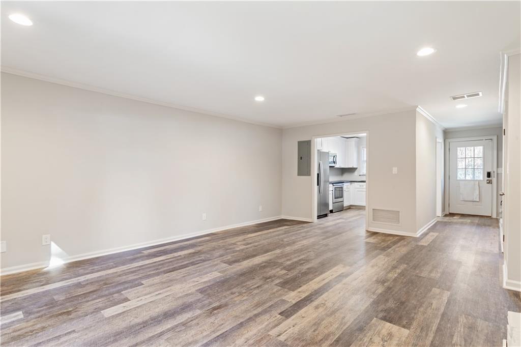 6700 Roswell Road, Unit 23A Atlanta, GA 30328 - Photo 9 of 18 a view of empty room with wooden floor