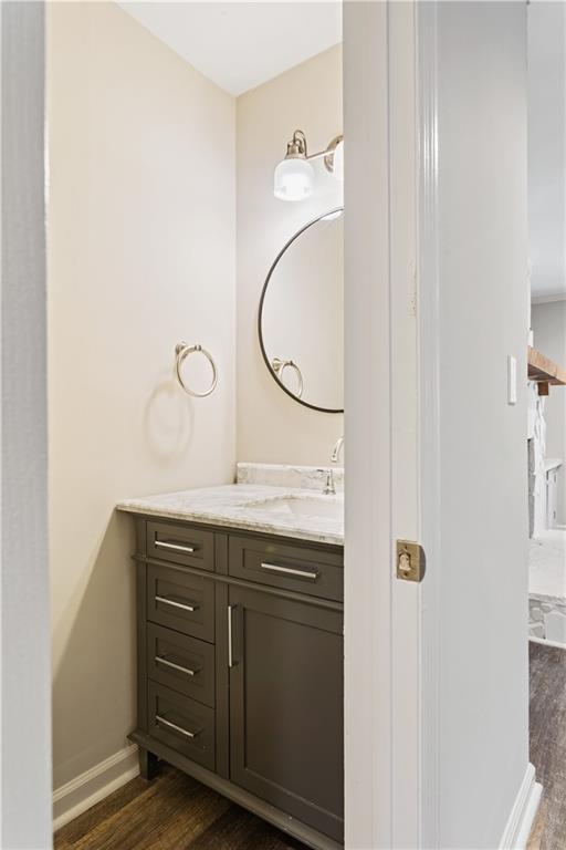 6700 Roswell Road, Unit 23A Atlanta, GA 30328 - Photo 10 of 18 a bathroom with a granite countertop sink and a mirror