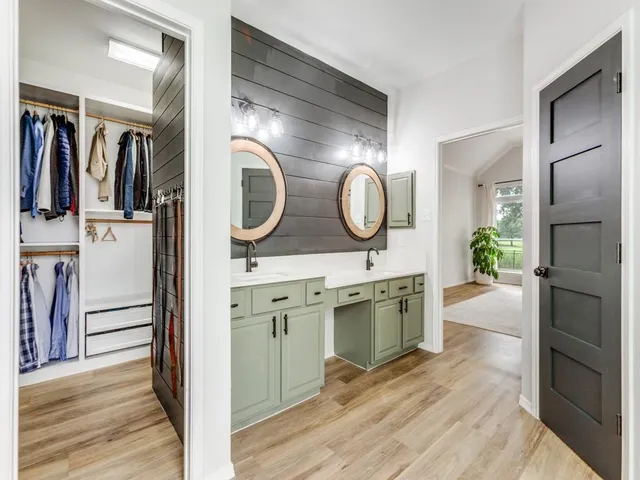 a bathroom with a tub and shower