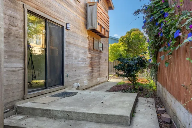 a pathway of a house with a yard