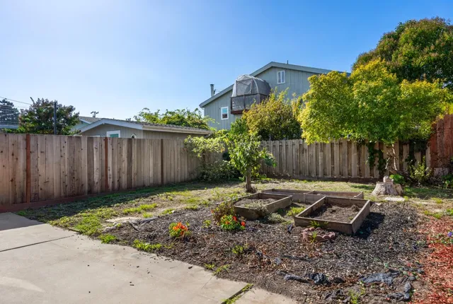 a backyard of a house with lots of green space