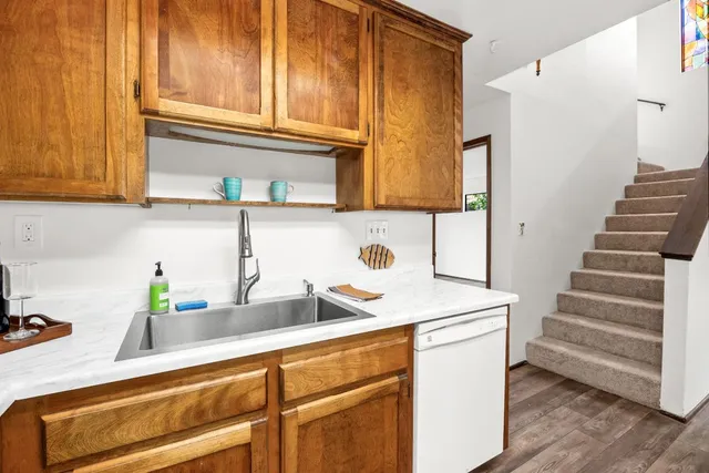 a kitchen with a sink and a refrigerator