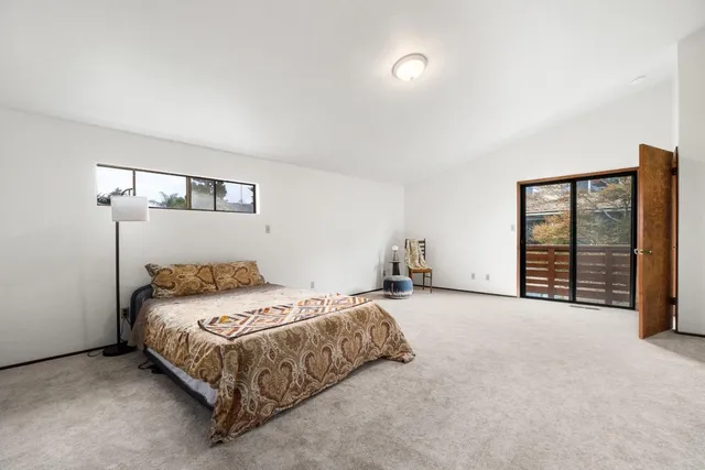 a bedroom with a bed and a table in it