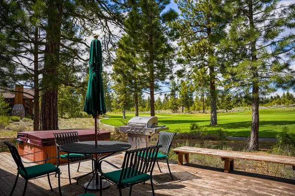 a view of a chairs and table in the patio