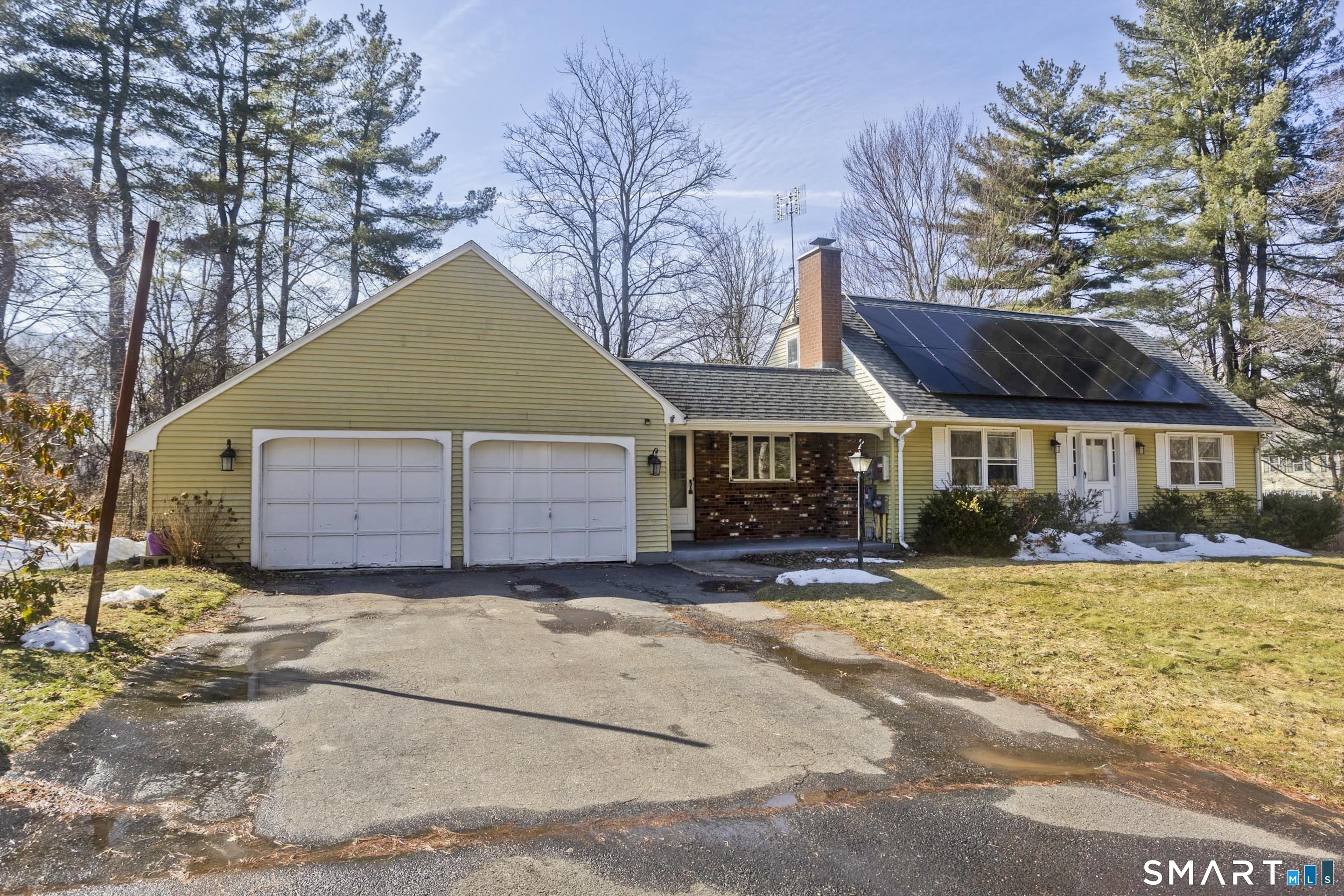 73 Laurel Street Enfield, CT 06082 - Photo 1 of 40 a view of a house with a yard and large tree