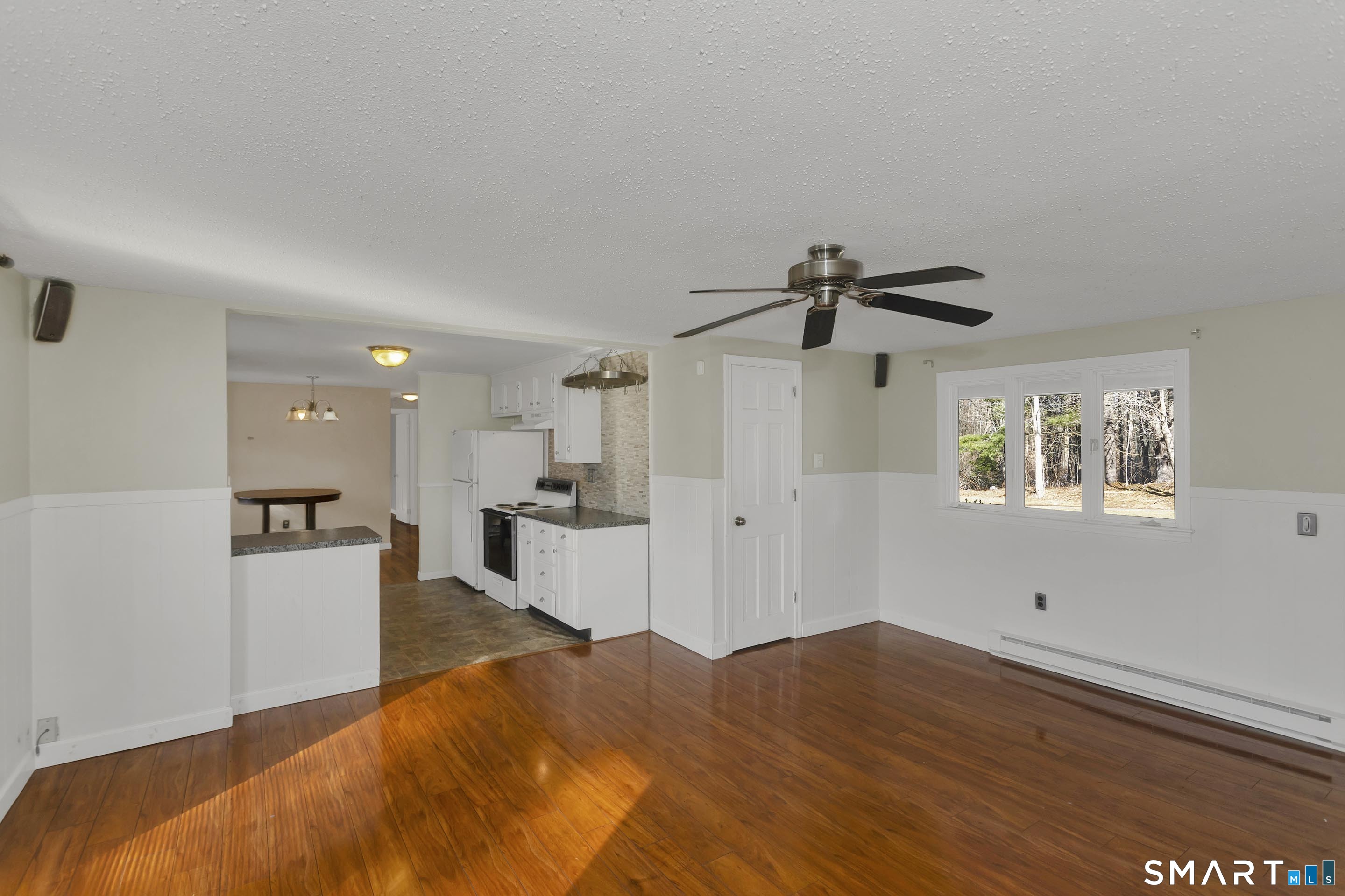 73 Laurel Street Enfield, CT 06082 - Photo 15 of 40 a view of a living room hardwood and kitchen
