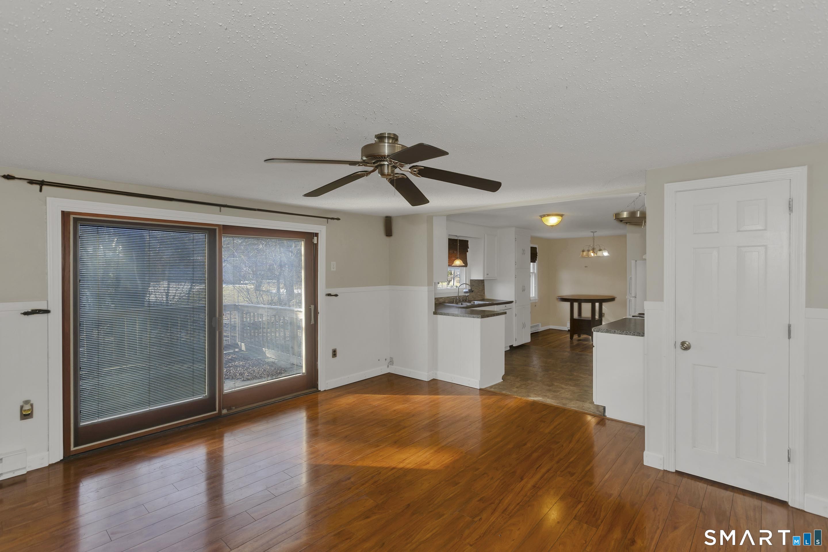 73 Laurel Street Enfield, CT 06082 - Photo 16 of 40 a view of a living room hardwood and kitchen