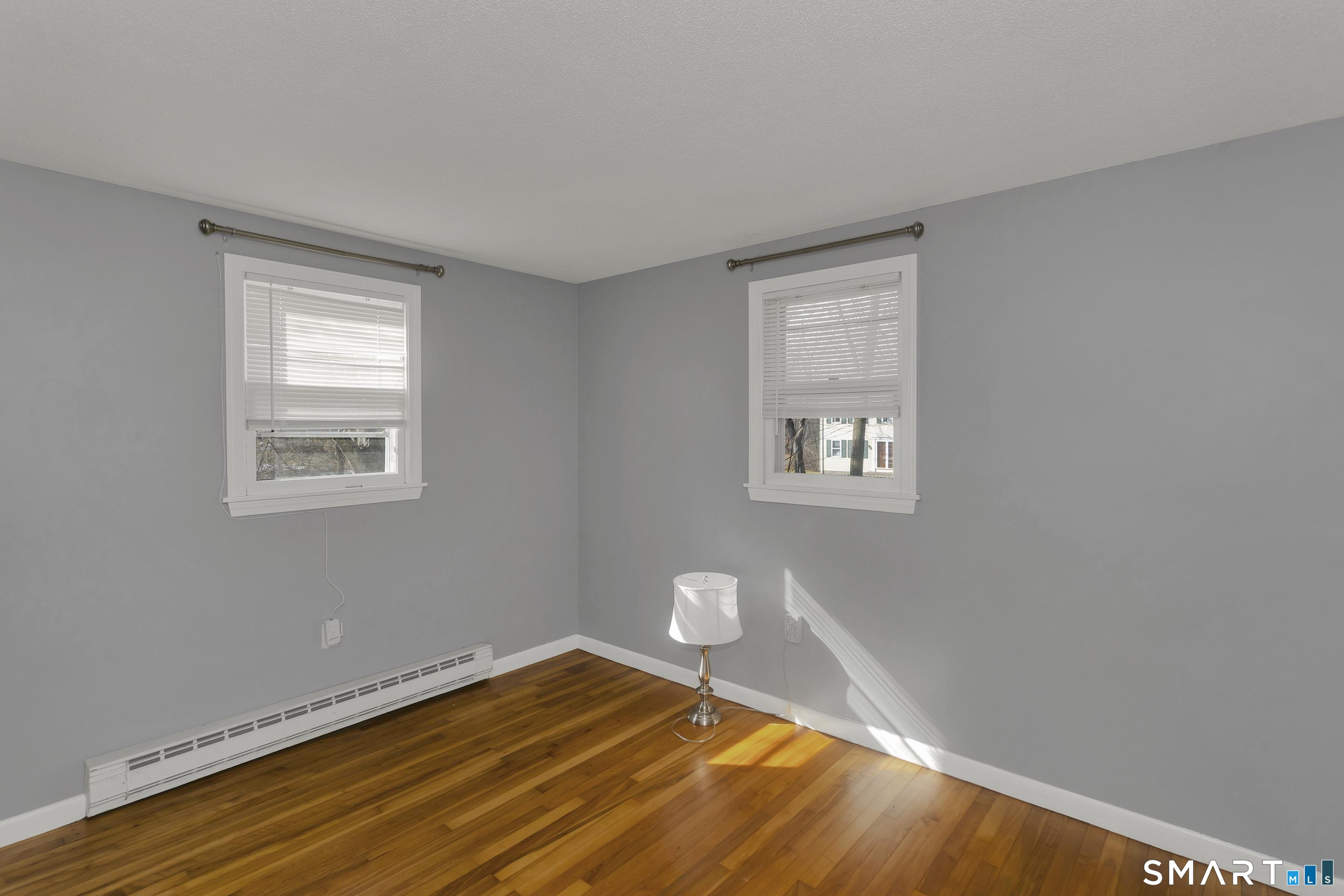 73 Laurel Street Enfield, CT 06082 - Photo 20 of 40 a view of a room with wooden floor and a window