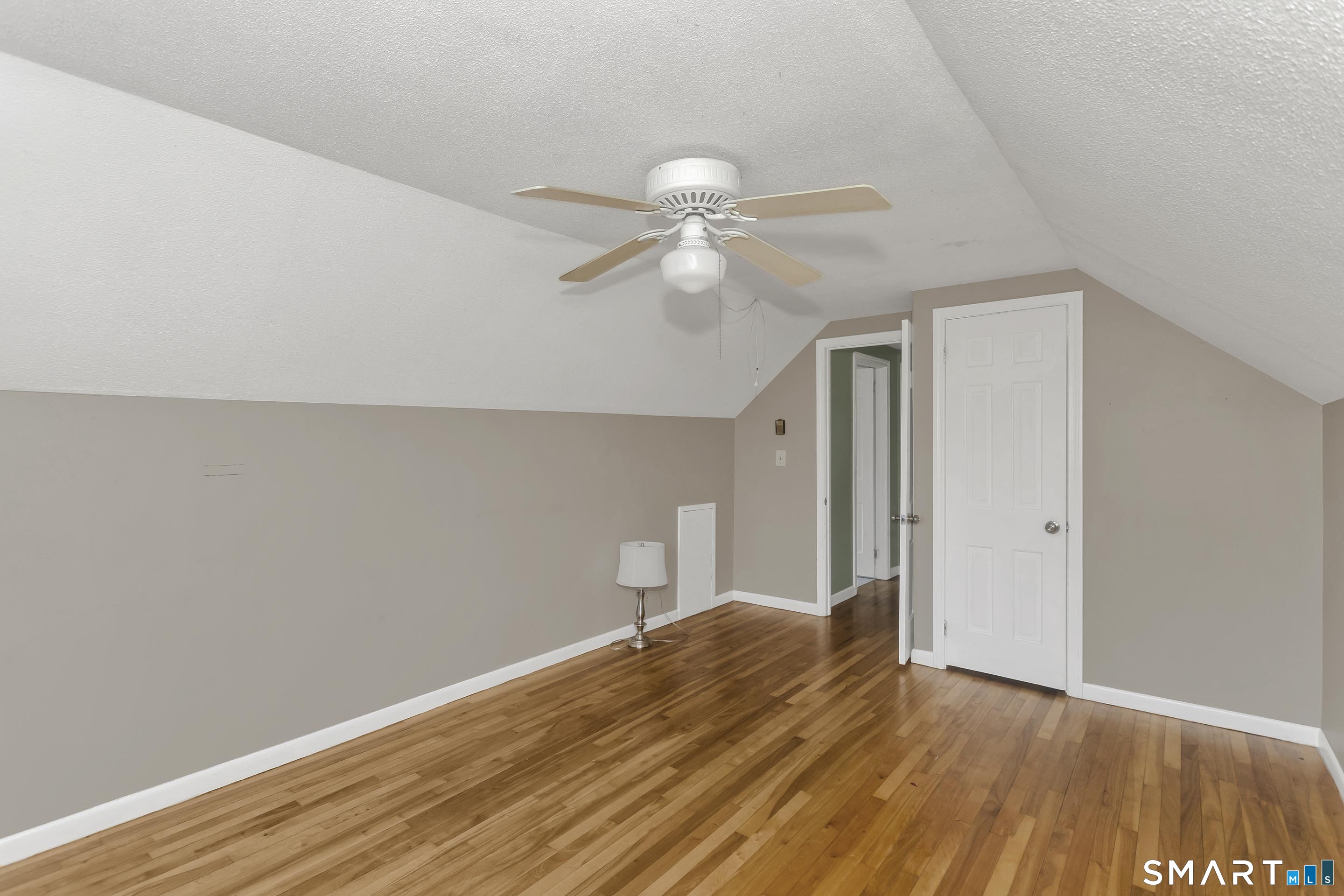73 Laurel Street Enfield, CT 06082 - Photo 27 of 40 a bedroom with a bed and a ceiling fan