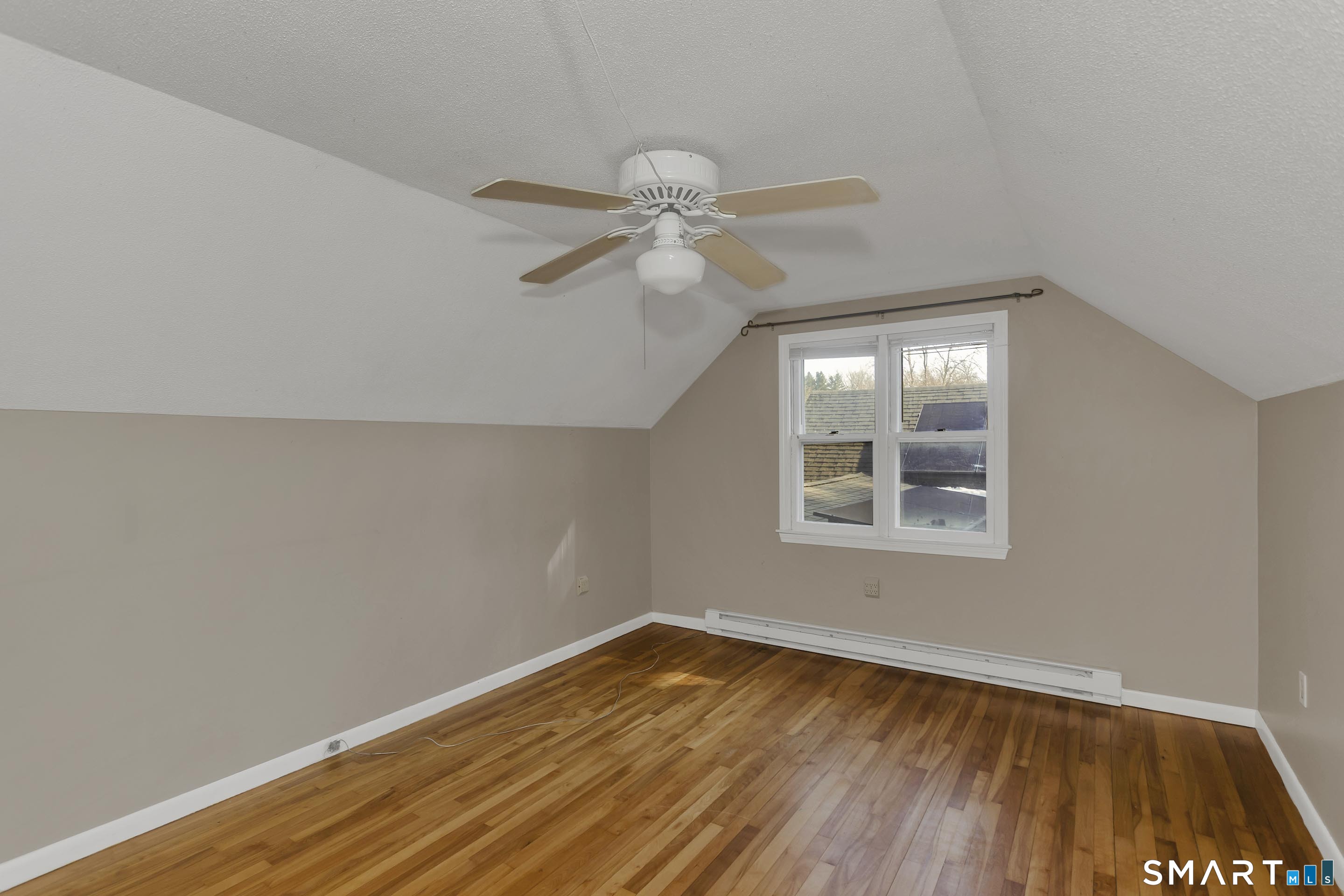 73 Laurel Street Enfield, CT 06082 - Photo 28 of 40 an empty room with a window and a ceiling fan
