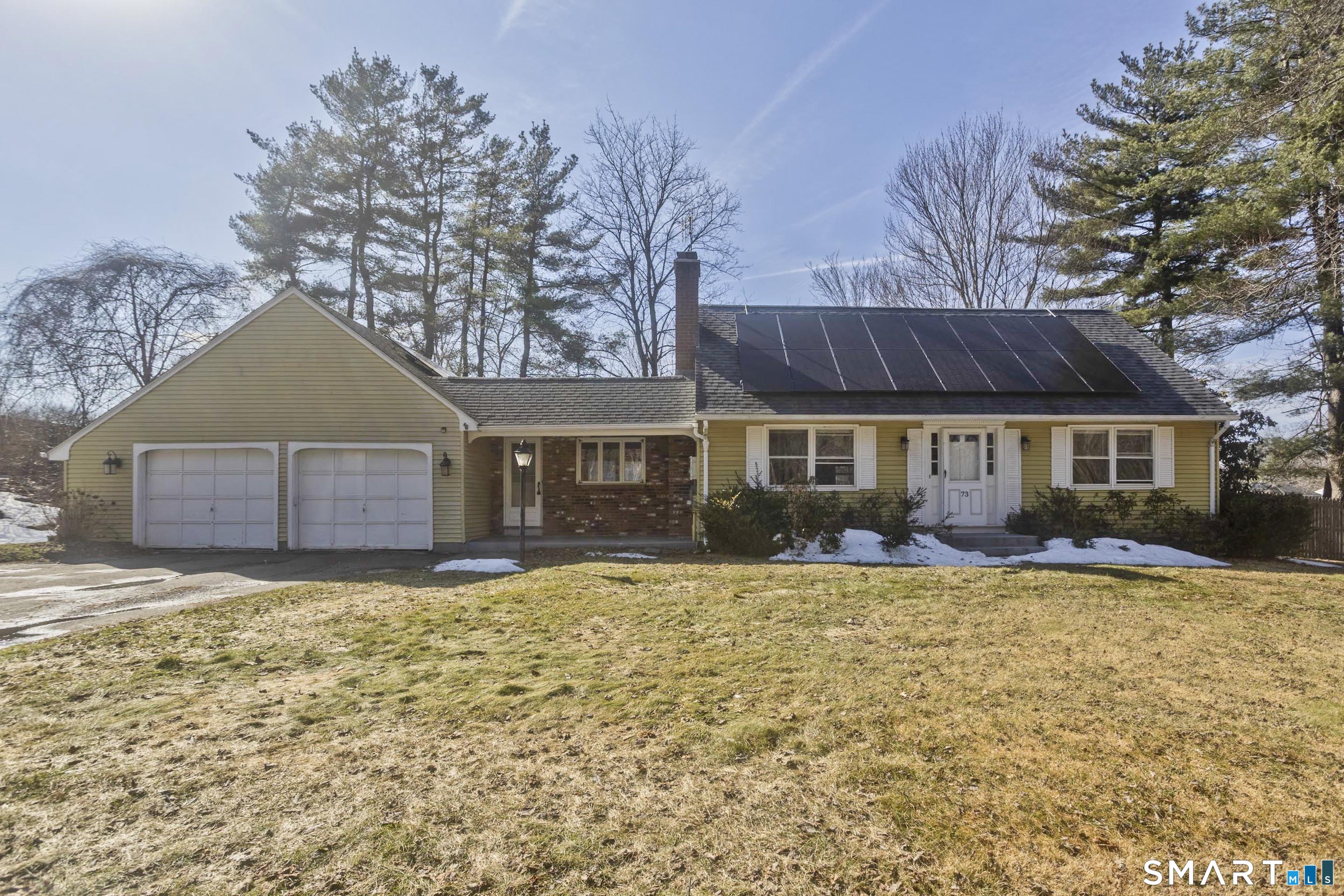 73 Laurel Street Enfield, CT 06082 - Photo 40 of 40 a front view of house with yard covered in snow
