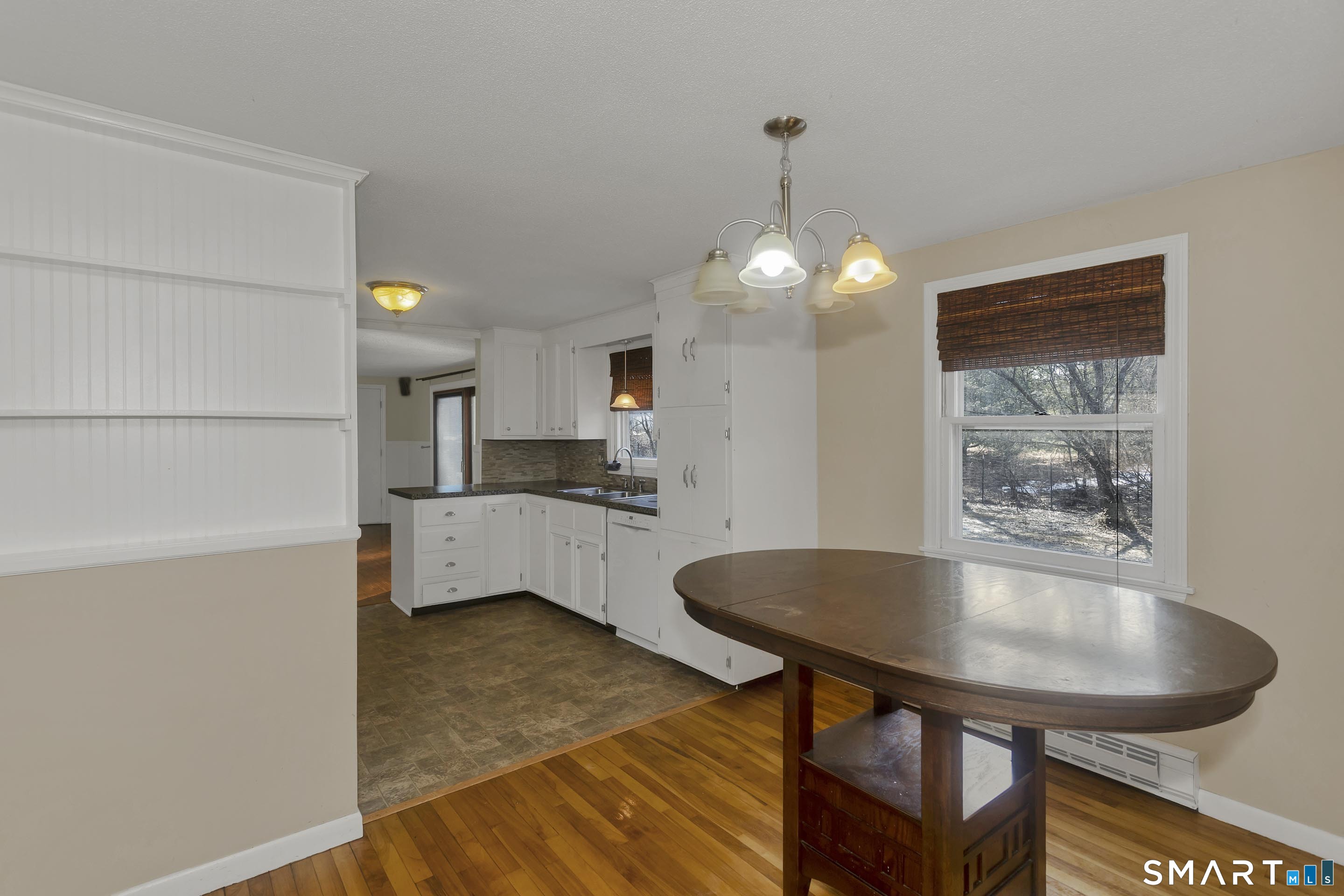 73 Laurel Street Enfield, CT 06082 - Photo 8 of 40 a living room with furniture and a table