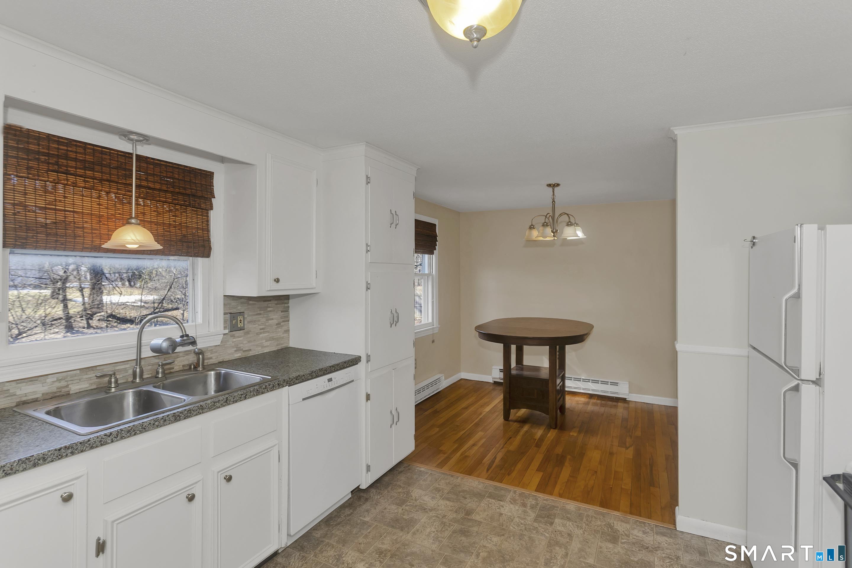 73 Laurel Street Enfield, CT 06082 - Photo 9 of 40 a kitchen with stainless steel appliances granite countertop a sink a stove and a refrigerator