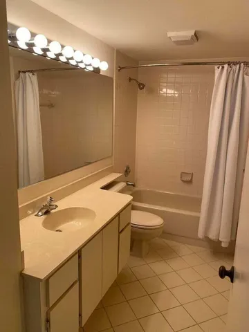 a view of a backyard with large trees