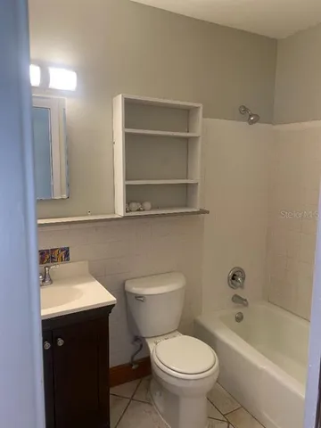 a bathroom with a sink toilet and bathtub
