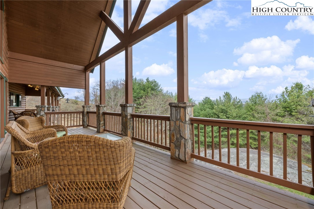 460 Deer Crossing Road Piney Creek, NC 28663 - Photo 13 of 29 a balcony view with a seating space