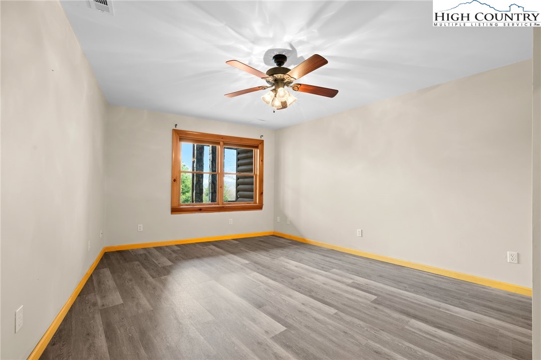 460 Deer Crossing Road Piney Creek, NC 28663 - Photo 23 of 29 a view of room with window and ceiling fan