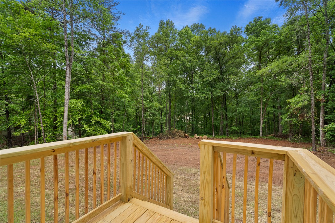 419 Austin Drive Anderson, SC 29624 - Photo 30 of 36 Enjoy the outdoor living space of this property, featuring a wooden deck with ample green space.