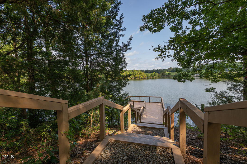 1708 Highpoint Street Wake Forest, NC 27587 - Photo 55 of 63 a view of a roof deck with wooden fence and plants