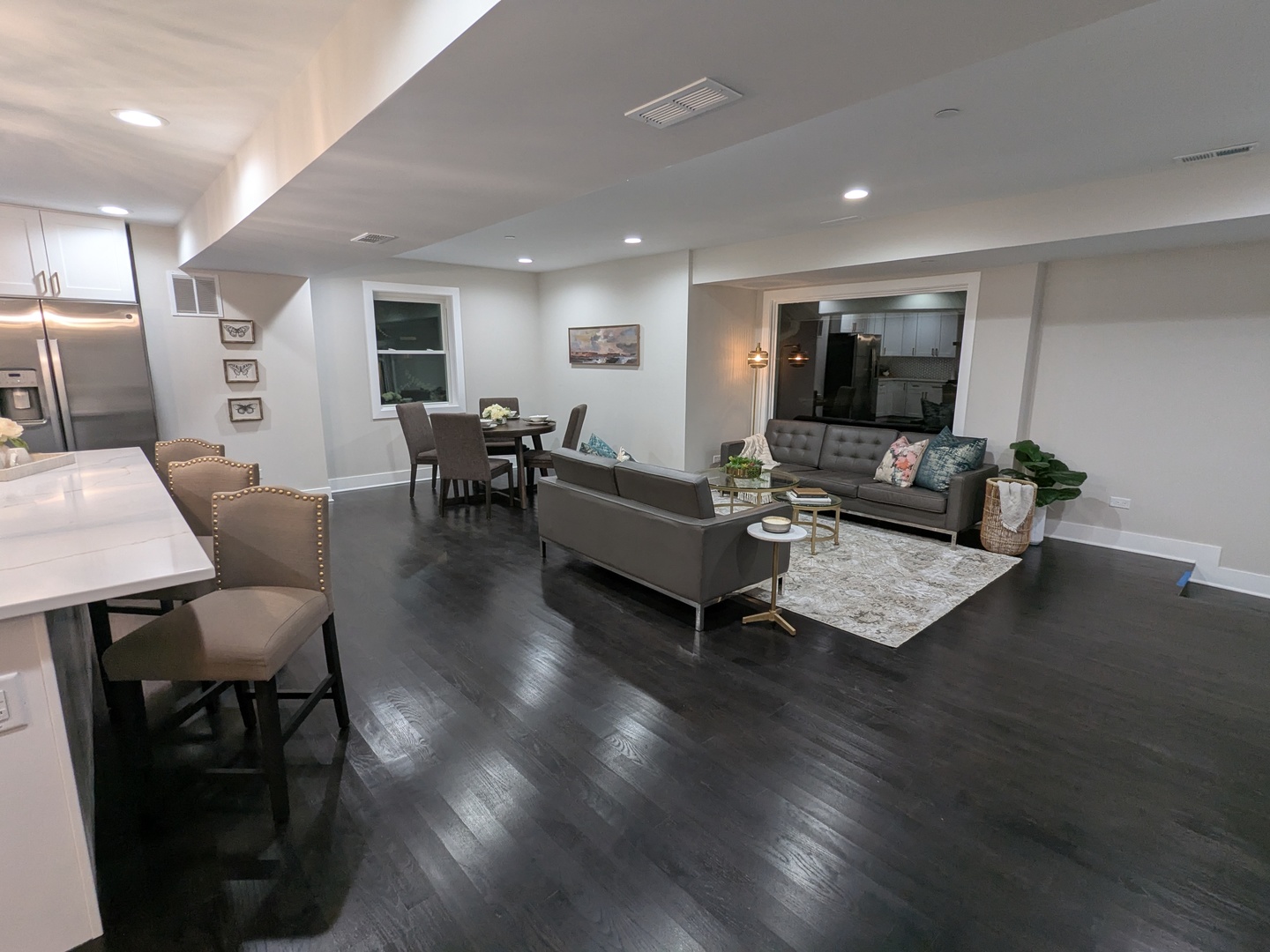 8600 East Prairie Road Skokie, IL 60076 - Photo 11 of 37 a living room with furniture wooden floor and a flat screen tv