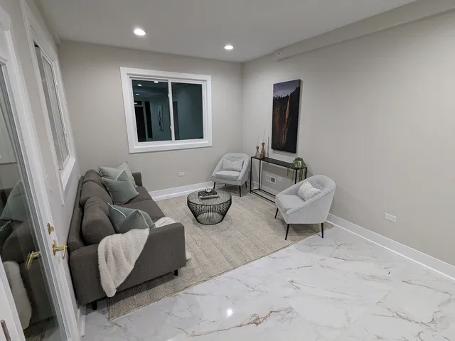 a living room with furniture and a window