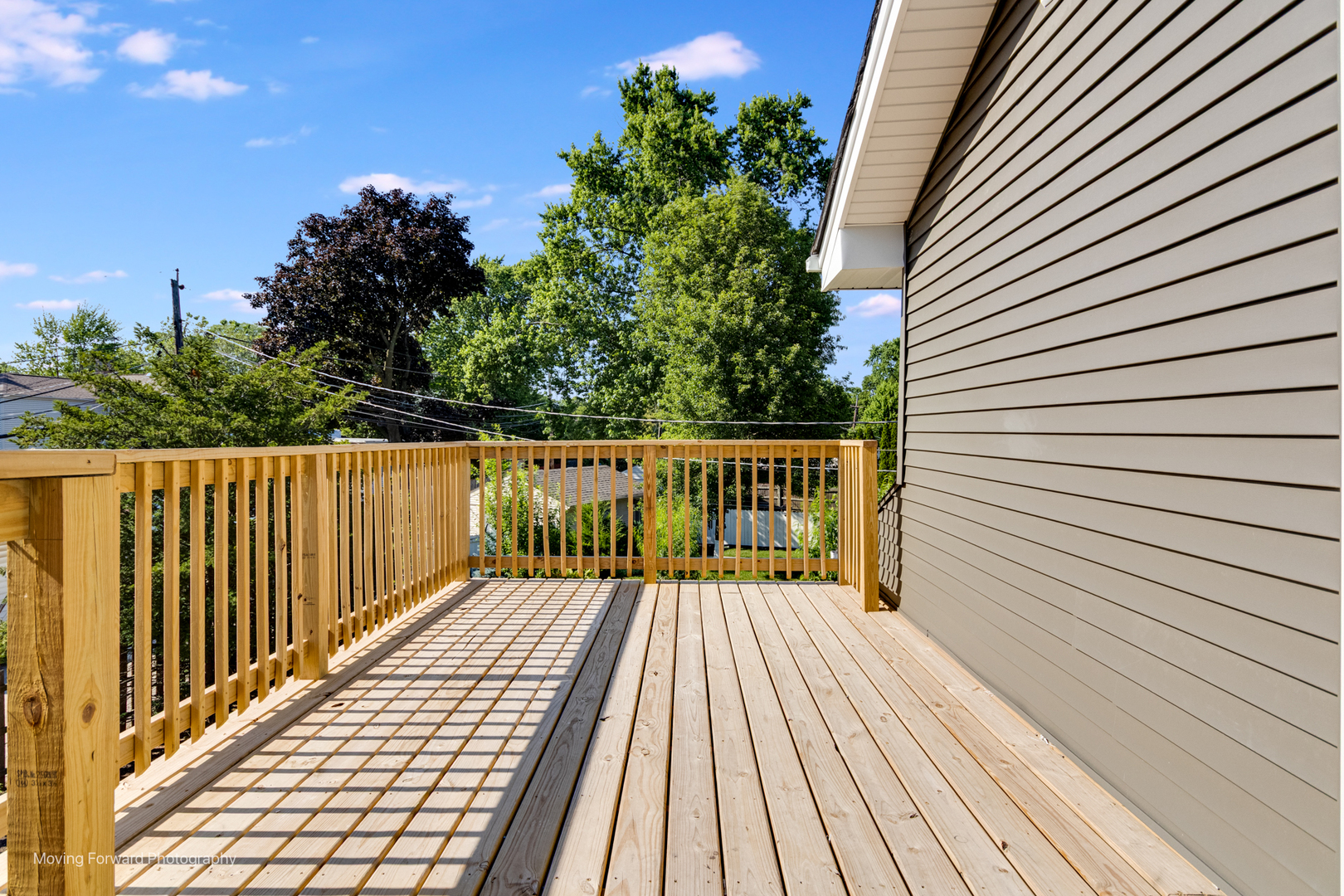 8600 East Prairie Road Skokie, IL 60076 - Photo 23 of 37 a view of wooden balcony and trees