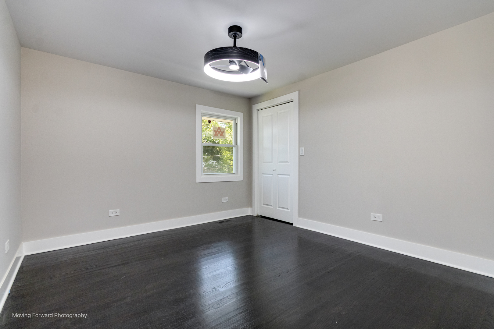 8600 East Prairie Road Skokie, IL 60076 - Photo 25 of 37 wooden floor in an empty room with a window