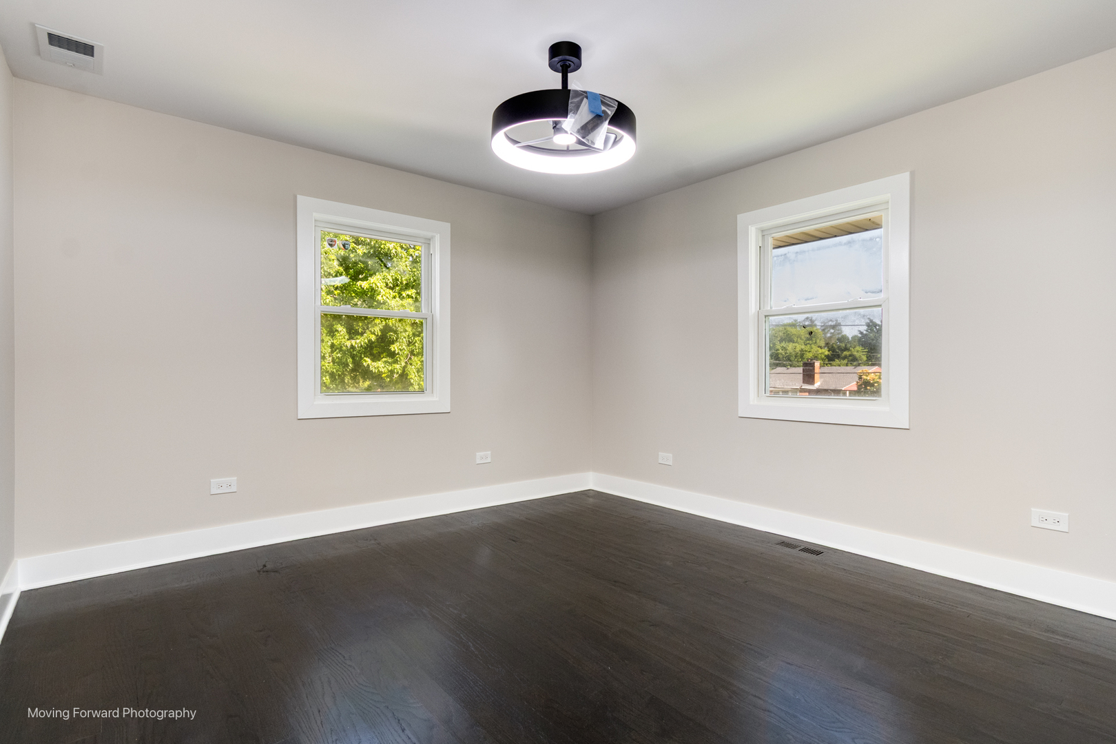 8600 East Prairie Road Skokie, IL 60076 - Photo 26 of 37 a view of an empty room with wooden floor and a window