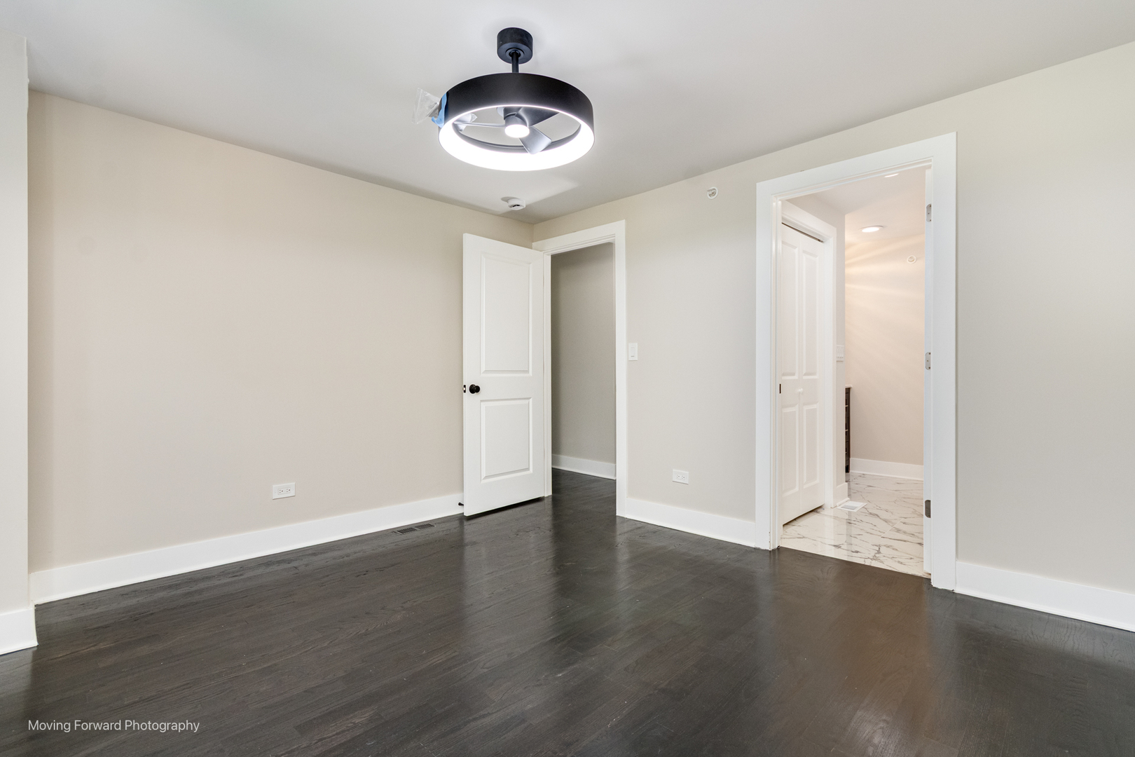 8600 East Prairie Road Skokie, IL 60076 - Photo 29 of 37 an empty room with wooden floor and windows