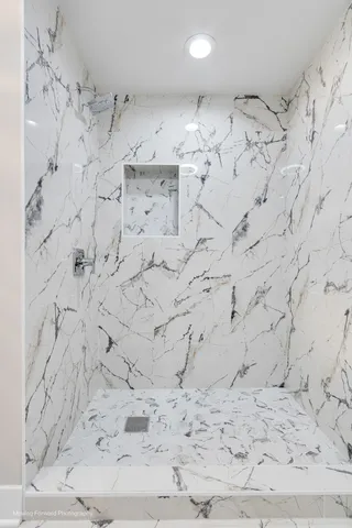 a view of a room with a ceiling fan