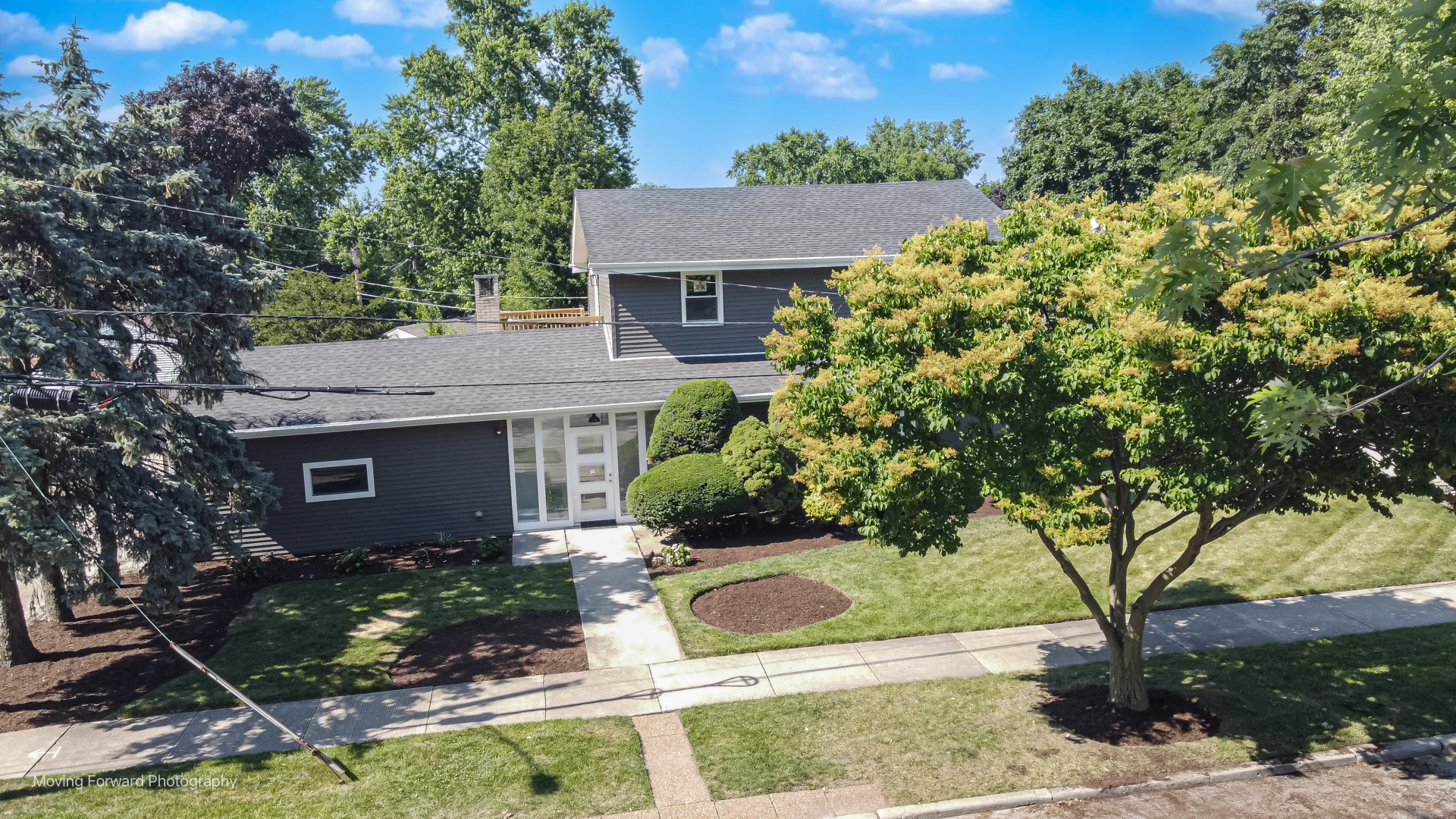 8600 East Prairie Road Skokie, IL 60076 - Photo 6 of 37 front view of house with a yard