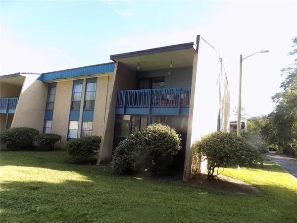 a house view with garden space