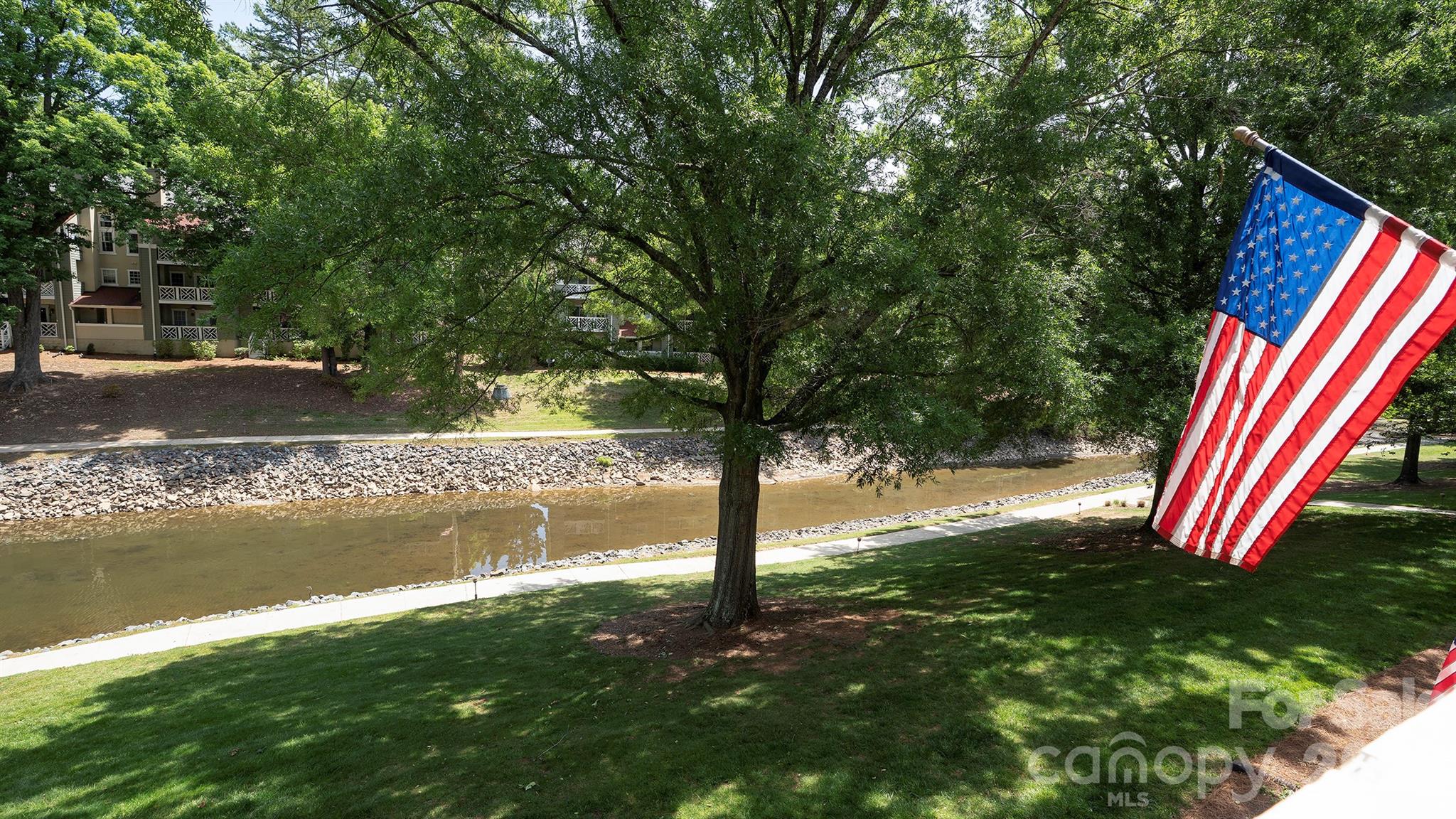 19823 Henderson Road, Unit C Cornelius, NC 28031 - Photo 18 of 23 a view of yard with tree in the background