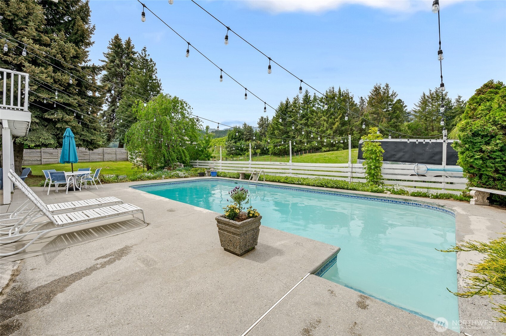 9656 North Road Peshastin, WA 98847 - Photo 7 of 40 a view of a swimming pool with a patio and a yard