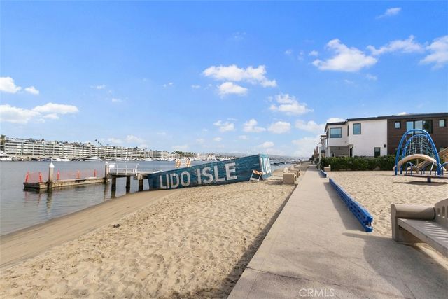 a view of a big house with a big yard and potted plants