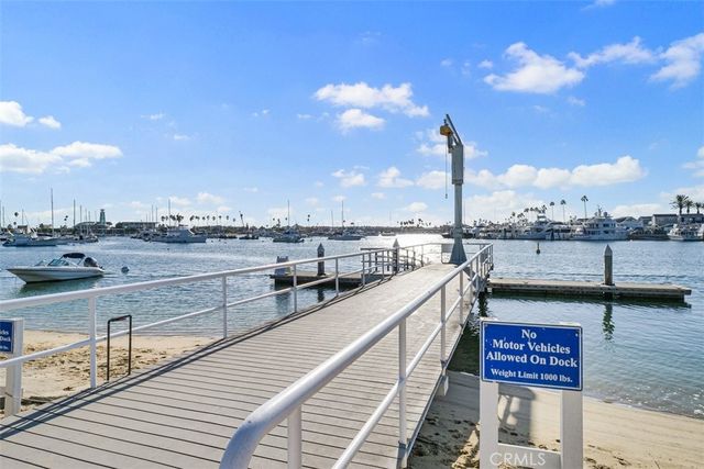 a view of a tennis ground with large trees