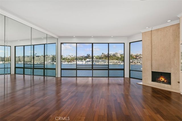 a kitchen with stainless steel appliances granite countertop a sink a stove and cabinets