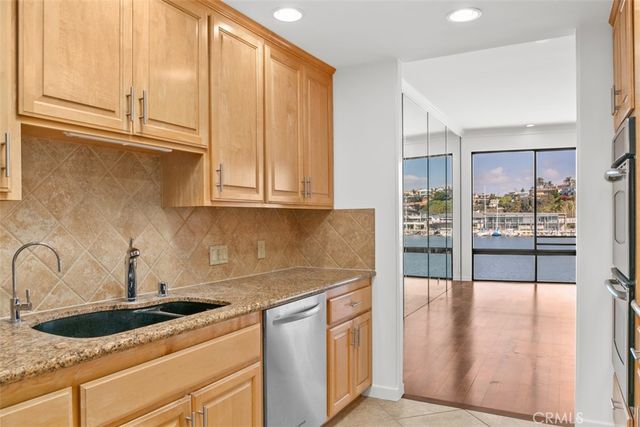 a bathroom with a sink mirror and a shower