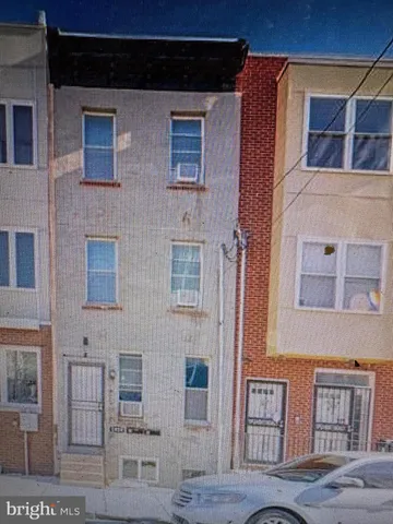 a couple of table and chair in front of building