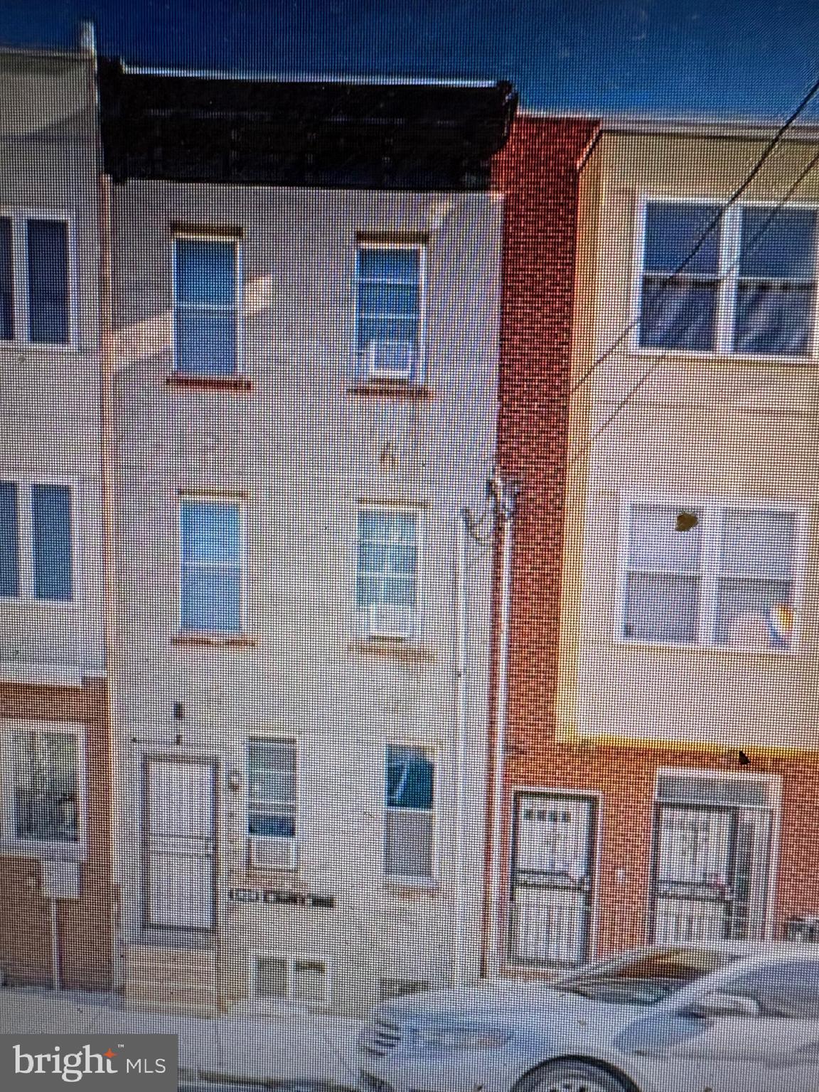 a couple of table and chair in front of building