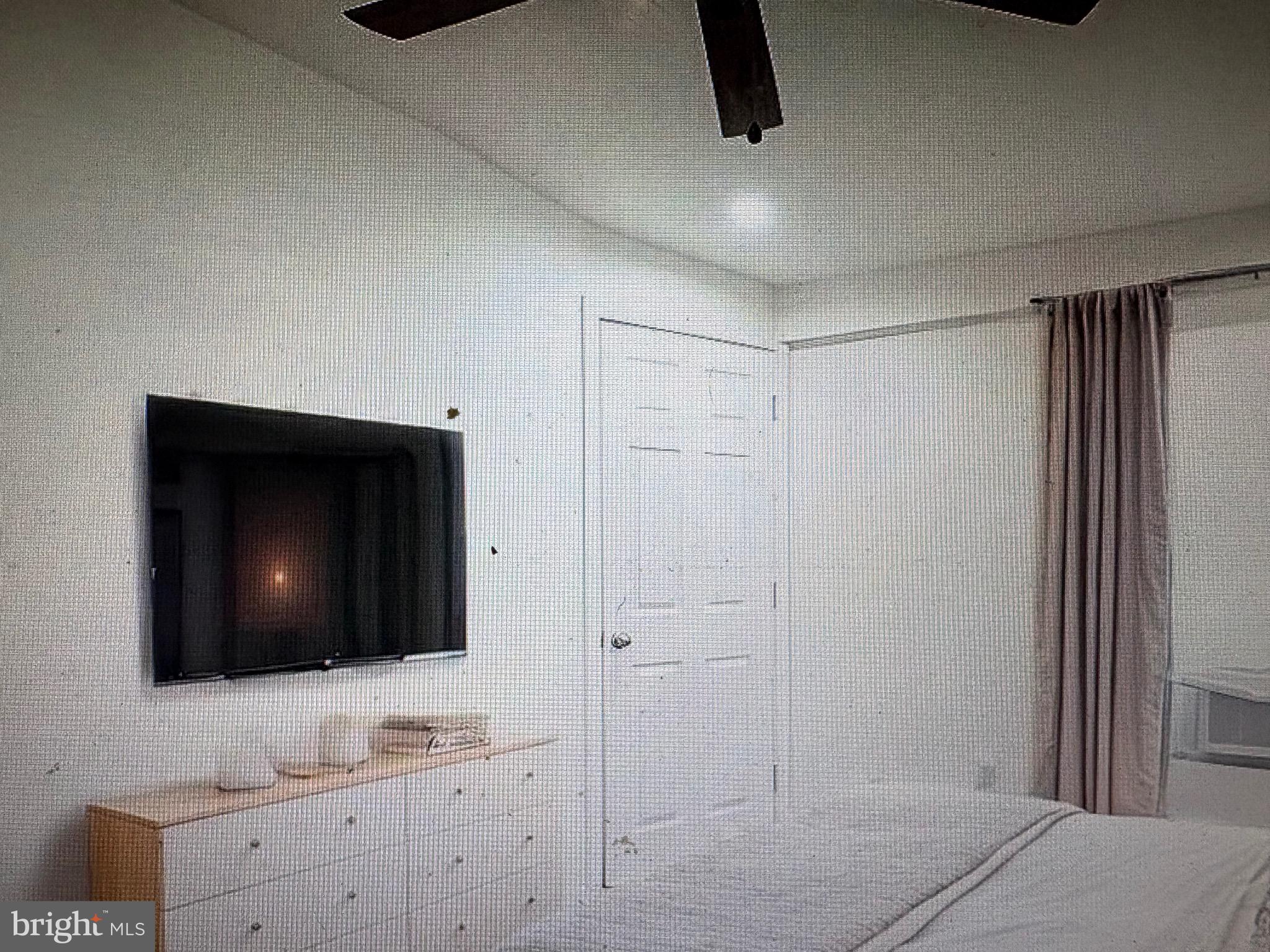 1929 North 9th Street Philadelphia, PA 19122 - Photo 15 of 21 a view of a livingroom with a flat screen tv