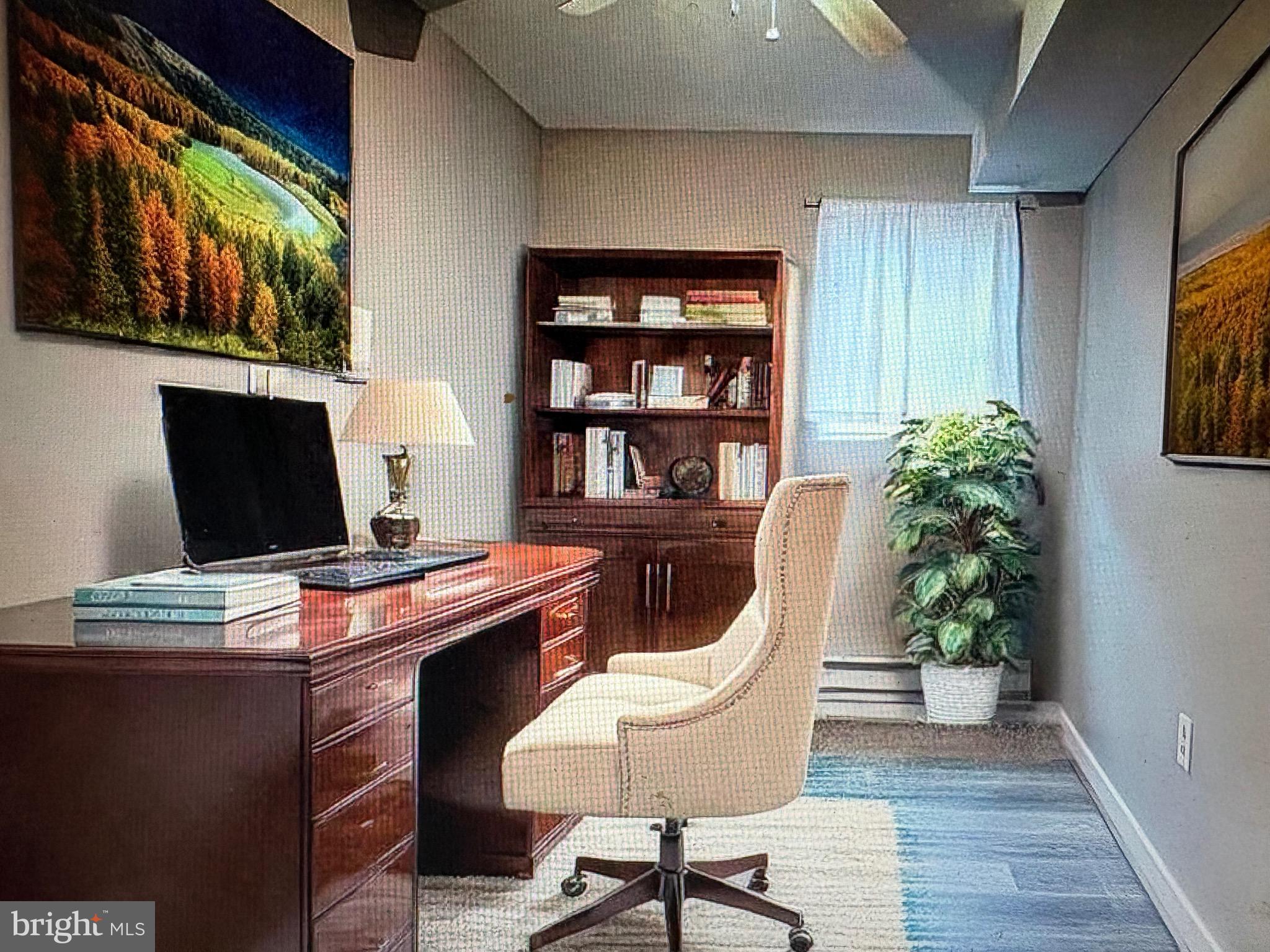1929 North 9th Street Philadelphia, PA 19122 - Photo 17 of 21 a view of a workspace with furniture and wooden floor