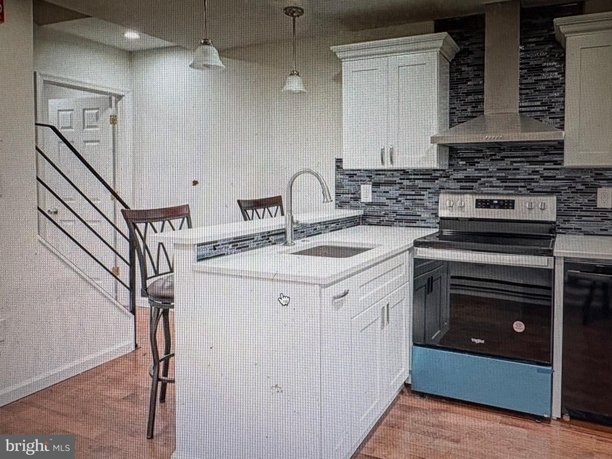 1929 North 9th Street Philadelphia, PA 19122 - Photo 3 of 21 a kitchen with a sink stove and cabinets