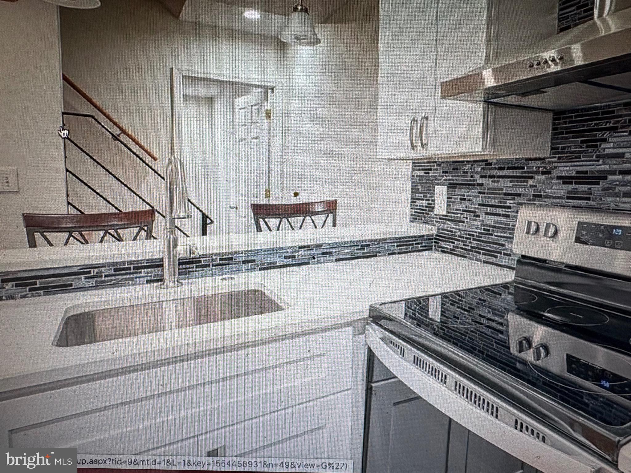 1929 North 9th Street Philadelphia, PA 19122 - Photo 4 of 21 a kitchen with a stove and a sink