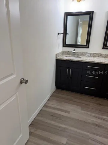 a view of an entryway with wooden floor