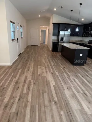 a view of kitchen with cabinets
