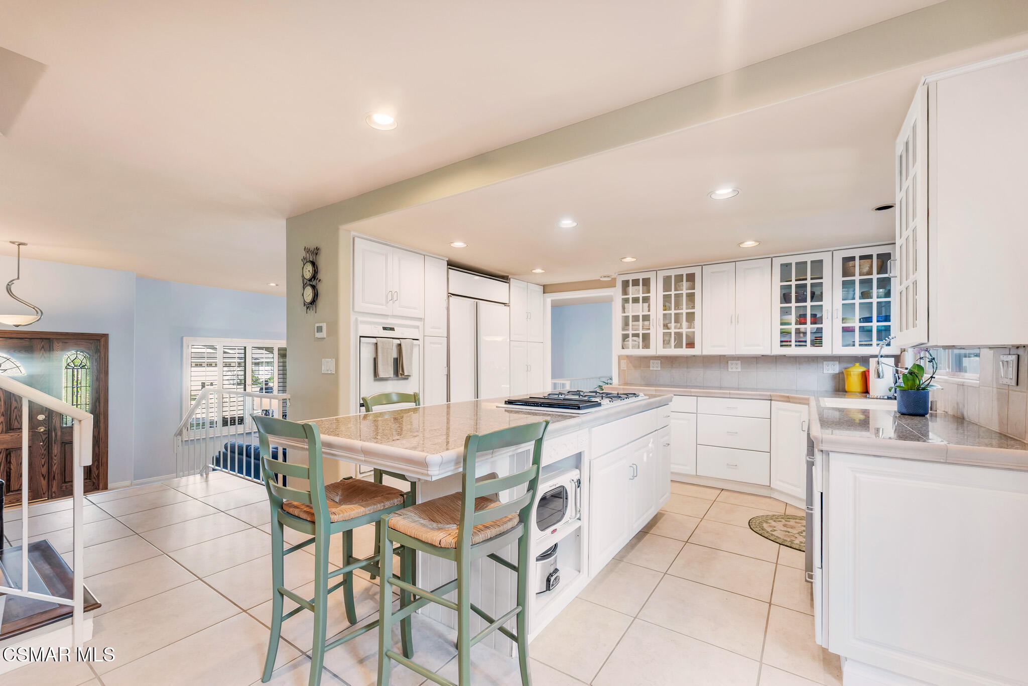 3037 Divernon Avenue Simi Valley, CA 93063 - Photo 12 of 44 a kitchen with stainless steel appliances kitchen island granite countertop a sink and cabinets