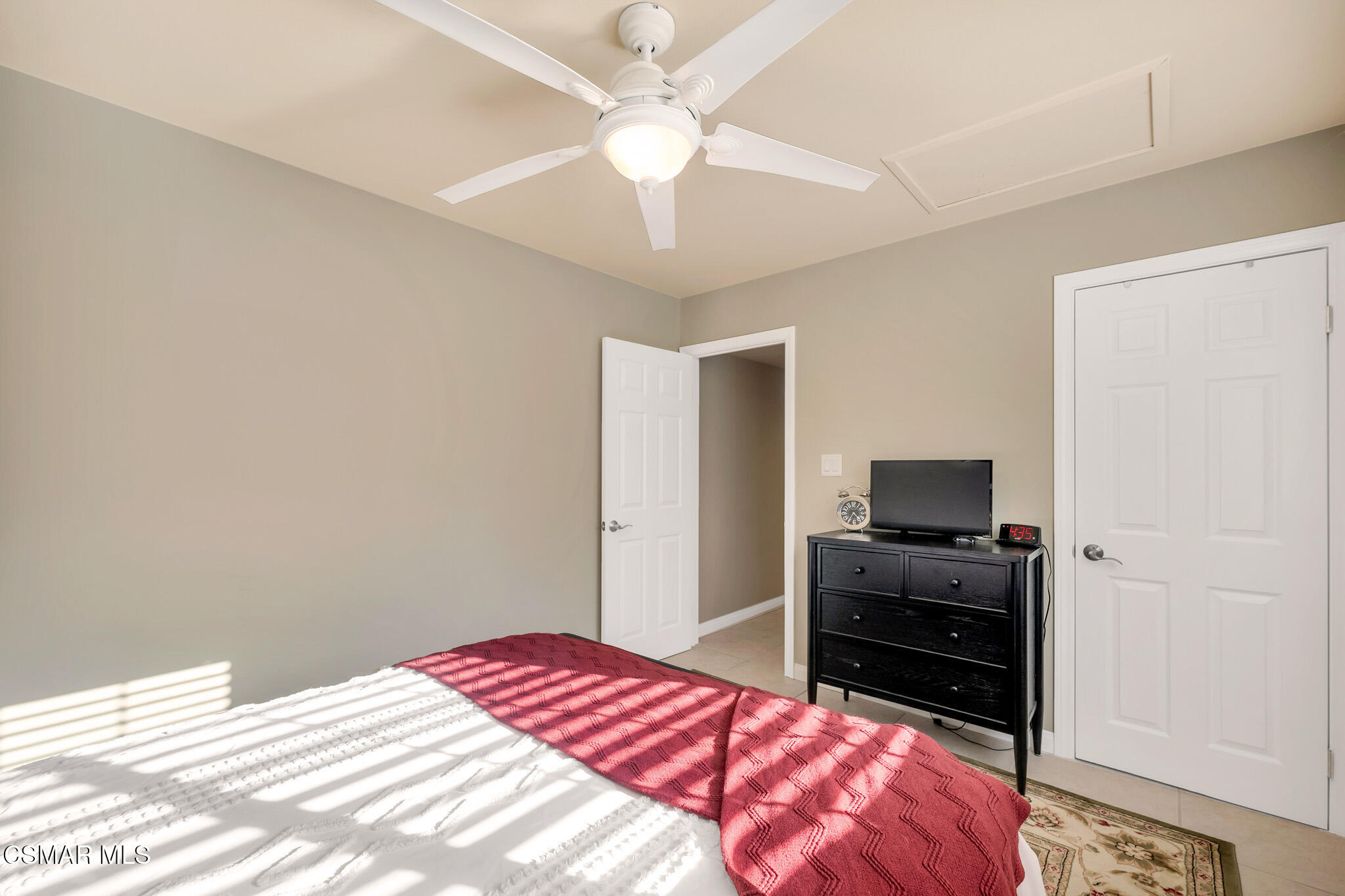 3037 Divernon Avenue Simi Valley, CA 93063 - Photo 21 of 44 a bedroom with a bed dresser and a flat tv screen