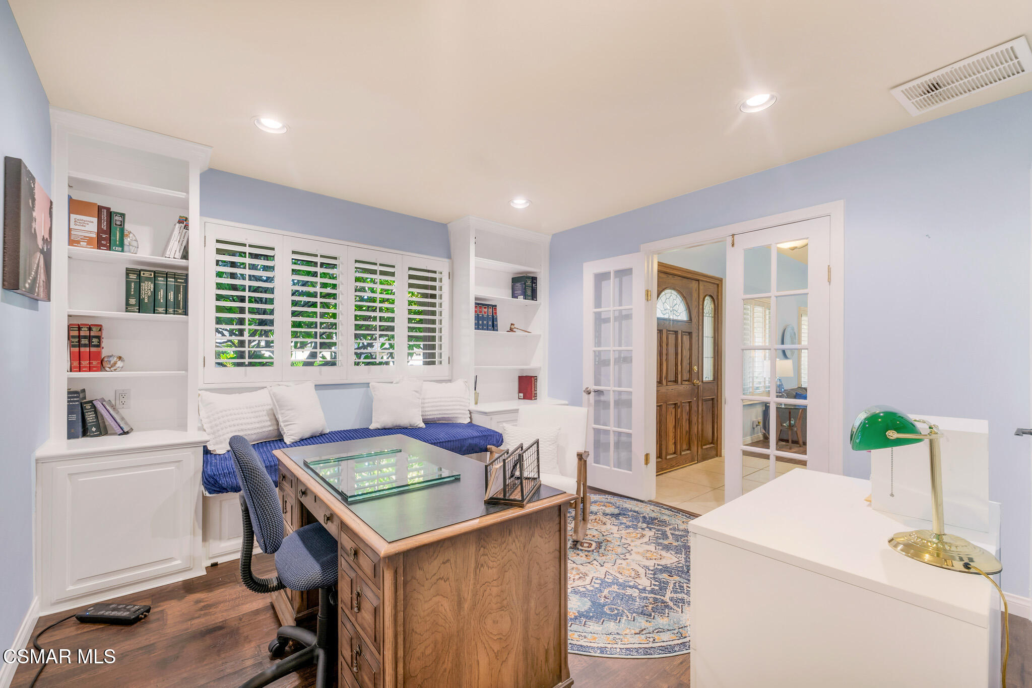 3037 Divernon Avenue Simi Valley, CA 93063 - Photo 22 of 44 a living room with a table chairs and a window