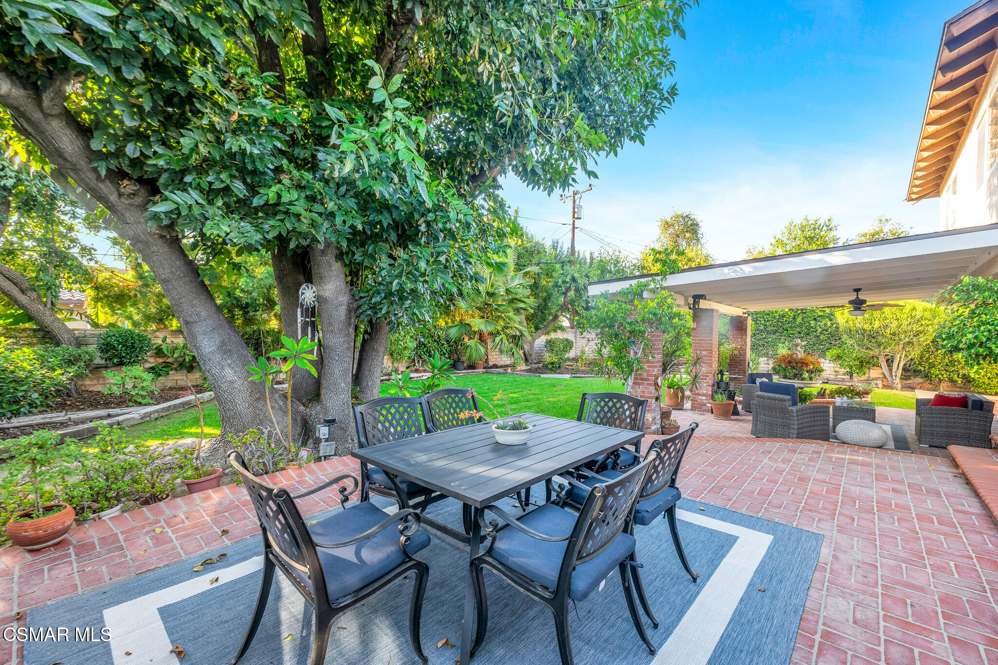 3037 Divernon Avenue Simi Valley, CA 93063 - Photo 35 of 44 a view of a table and chairs in patio with wooden fence
